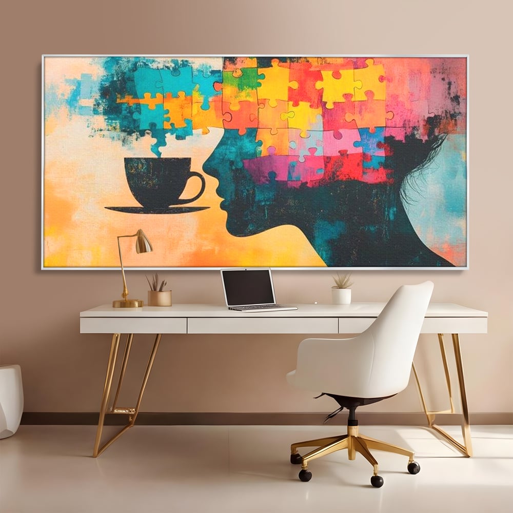 Tablou canvas cu tablou canvas cu silueta de femeie si puzzle, in rama de aluminiu argintiu, pe perete intr-un birou